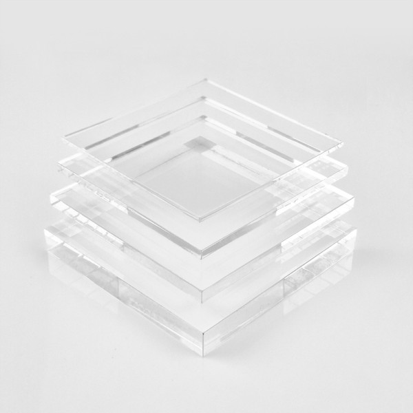 Clear cast acrylic sheets stacked on top of each other, creating a transparent and orderly arrangement.