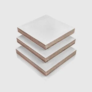 12mm White PP Faced Plywood (WISA Multiwall – Textured) 12mm White PP Faced Plywood (WISA Multiwall) sheets stacked on top of each other, in an orderly arrangement.