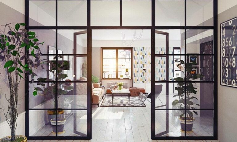 A clear PETG partition wall in a living space surrounded by furniture and plants.