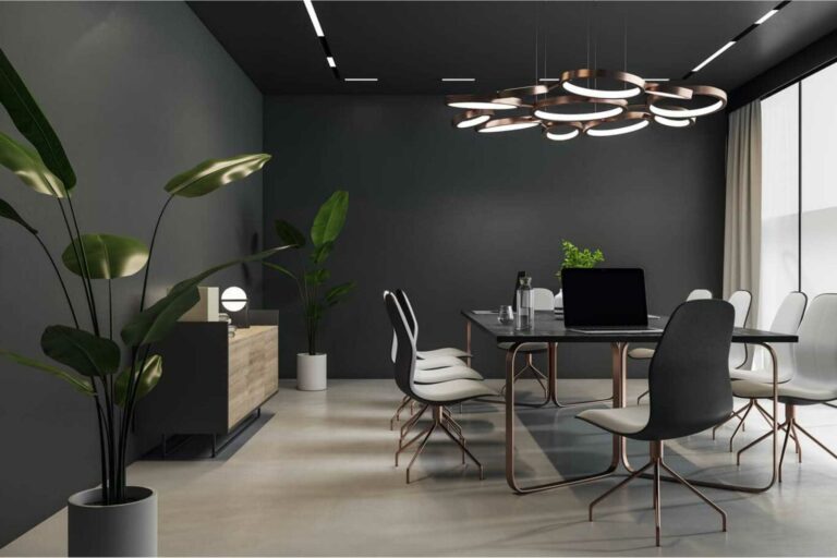 A modern office with PVC wall paneling and office furniture.
