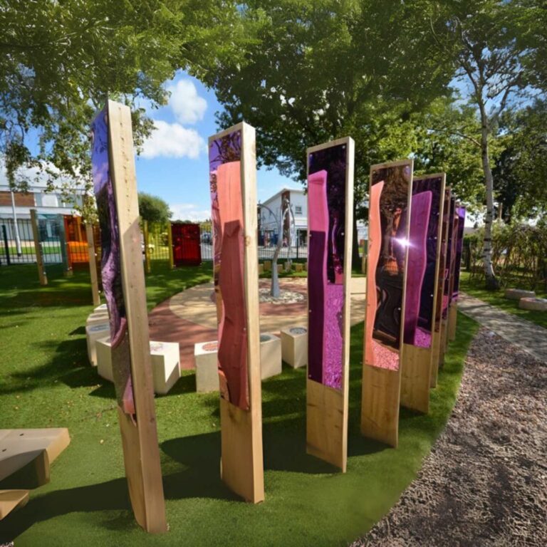 An outdoors playground with pink coloured mirror sheets.