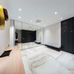 Mirrored wardrobe in bedroom