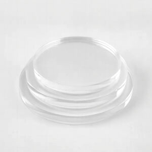 Stack of three clear extruded acrylic disc circles in different sizes.